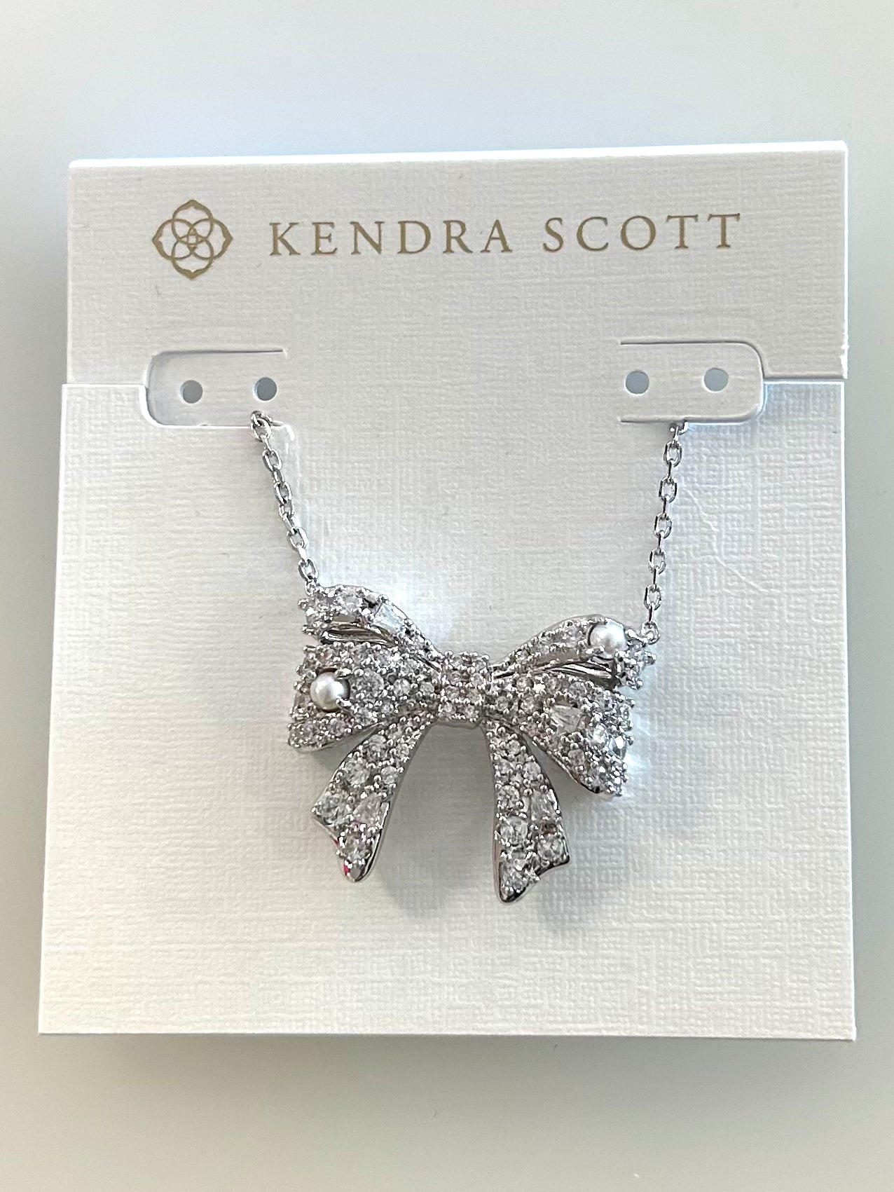 9608875756 Krista Bow Pendent Nck Rhodium Kendra Scott